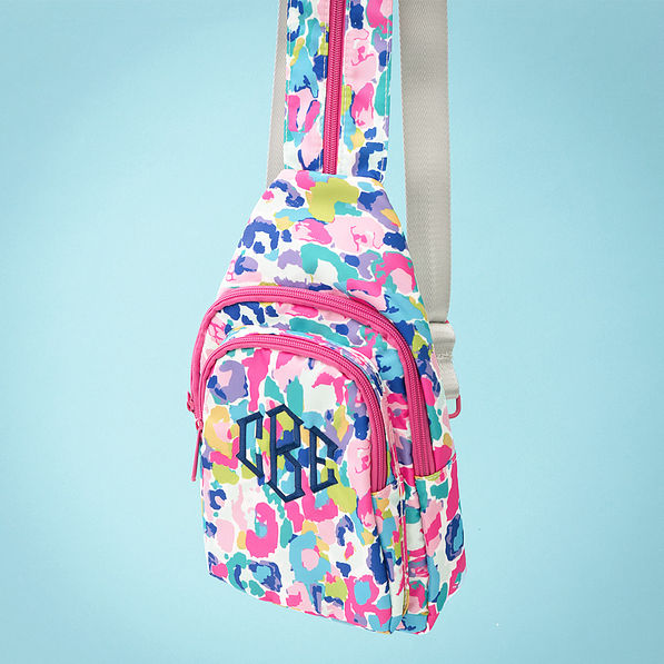 watercolor cheetah sling backpack on blue background