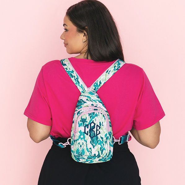 girl wearing bermuda ikat monogrammed sling pack