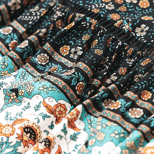 close up of black paisley midi skirt fabric