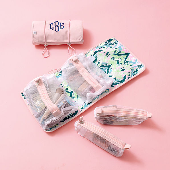 light pink toiletry kit on pink paper