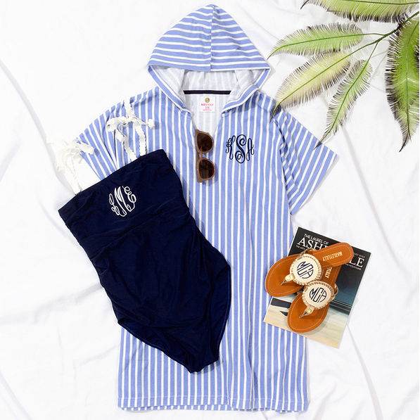 terry cover up with navy one piece bathing suit