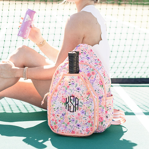 girl on court with coral floral monogrammed pickle ball bag