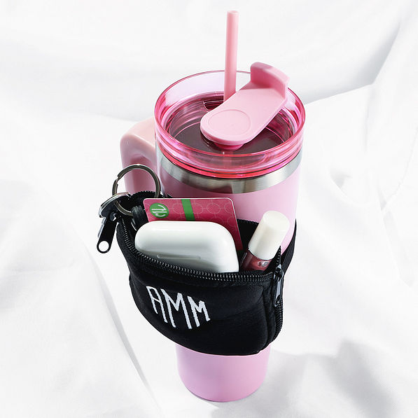 black water bottle belt bag on pink travel tumbler