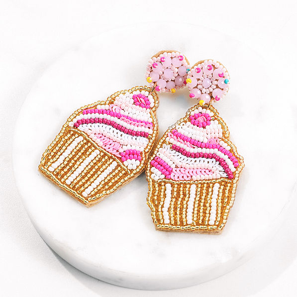 cupcake earrings on marble