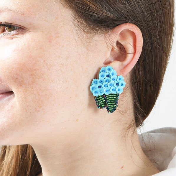 blue hydrangea earring in ear