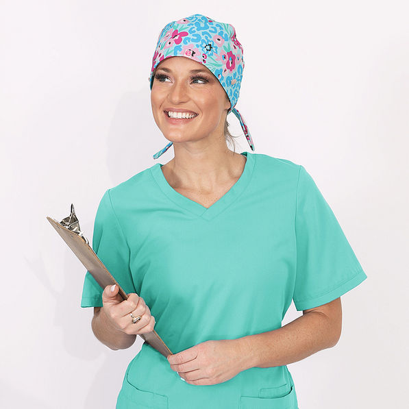 Ashley wearing magenta wild blooms scrub cap