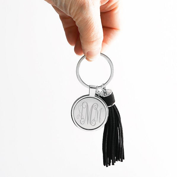 black tassel key chain in hand