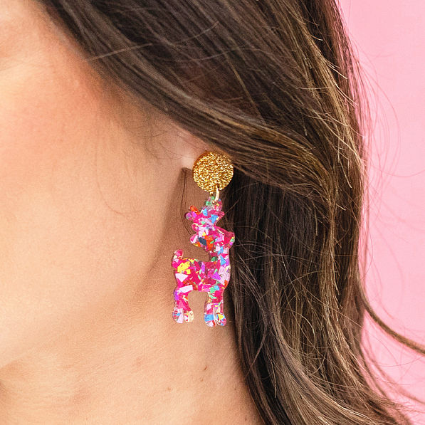multi reindeer earrings in ear