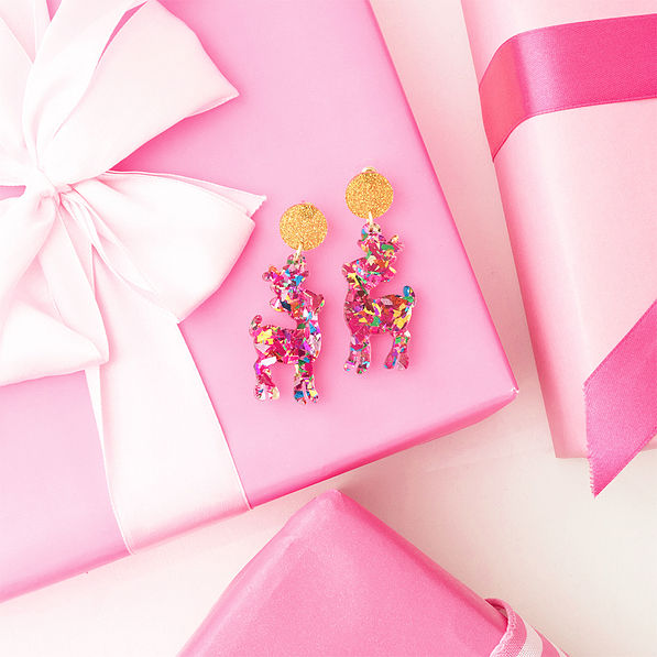 multi reindeer earrings on gift boxes