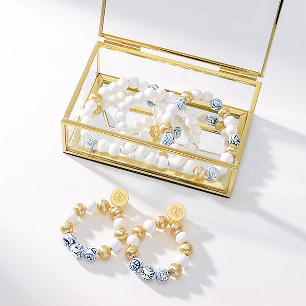 gold bracelet and monogrammed earrings coastal set in gold box