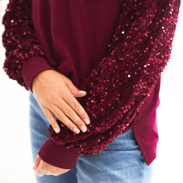 burgundy sequin sweatshirt up close
