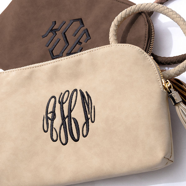 brown and taupe monogrammed wristlet clutch