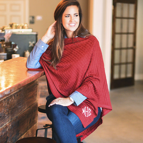 monogrammed crimson poncho with jeans