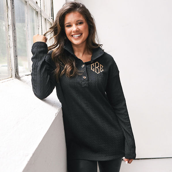 black monogrammed cable knit pullover with leggings