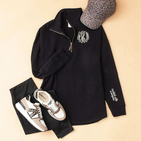 black faith pullover flatlay