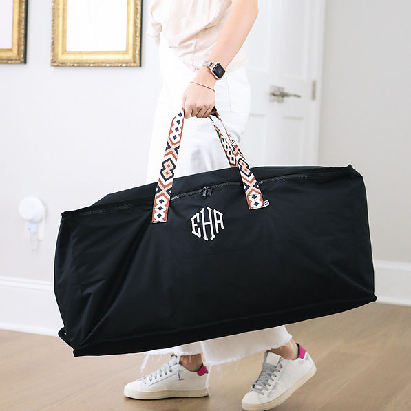 girl carrying monogrammed foldable storage bag