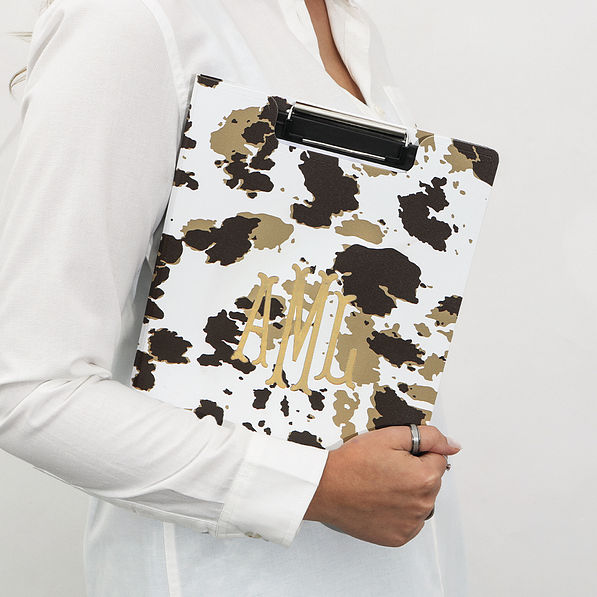 cowhide clipboard in arms