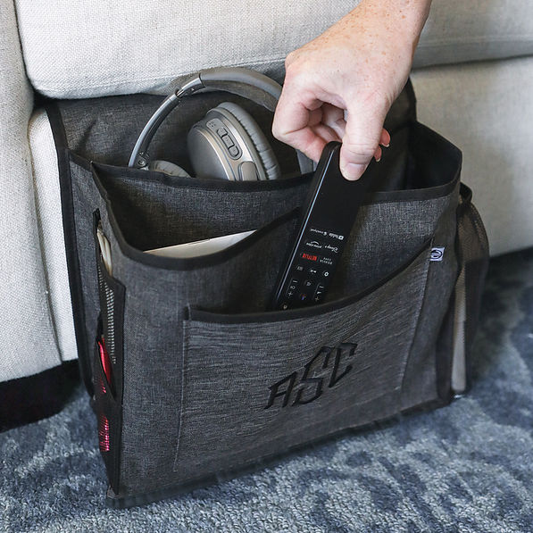 heathered grey bedside monogrammed caddy on couch