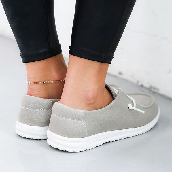 light gray canvas slip ons - back view