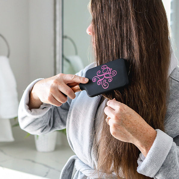 black hairbrush in hair