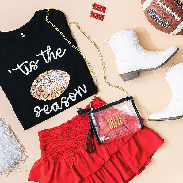 black crossbody bag with football gameday outfit and accessories