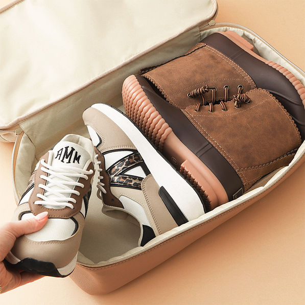 ivory canvas weekender with shoes in bottom compartment