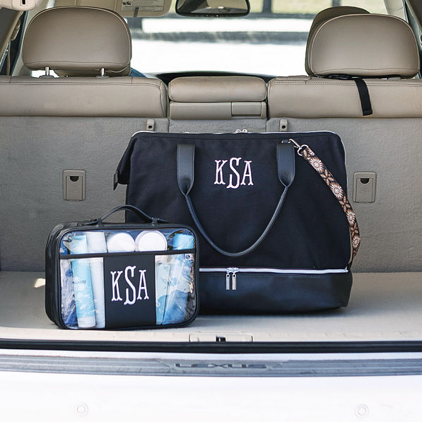 clear large toiletry bag and canvas weekender in black in car