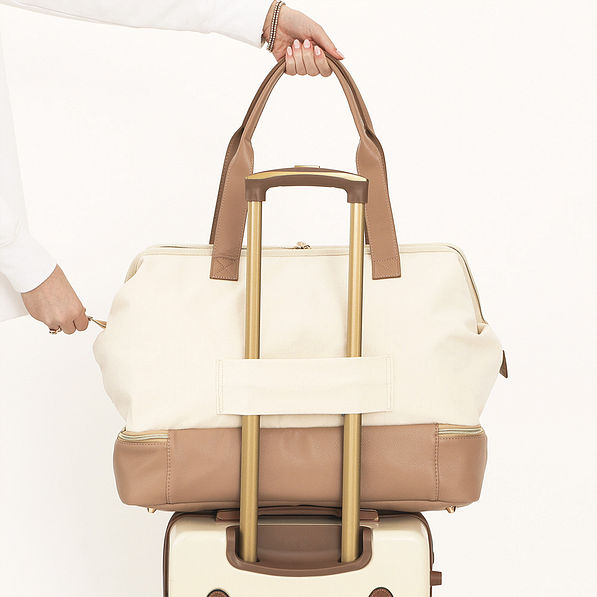 ivory canvas weekender on vintage suitcase