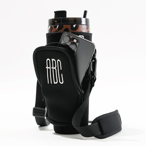 black water bottle holder with phone in pocket