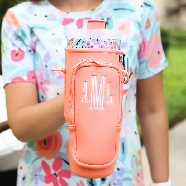 coral water bottle holder in hand