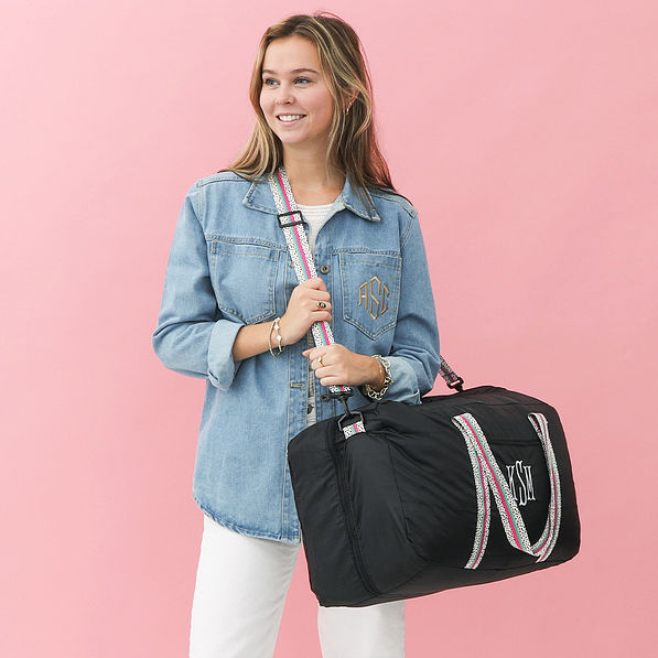 black spottie monogrammed packable weekender over shoulder