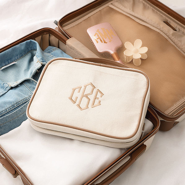 ivory travel toiletry bag inside vintage suitcase