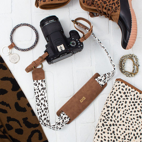 leopard camera strap flatlay - 2025