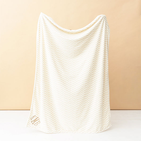 neutral herringbone plush blanket studio shot