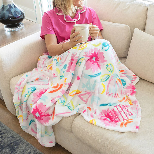 girl wrapped in personalized painted petals blanket close