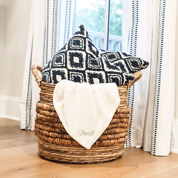 ivory plush blanket in basket