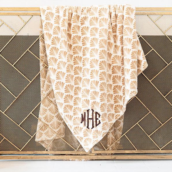 khaki shells personalized plush blanket on gold fence