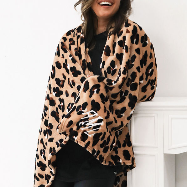 classic cheetah plush blanket wrapped around peyton