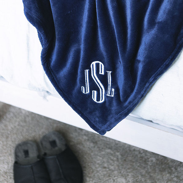 close up of navy personalized blush blanket