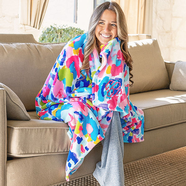 girl wrapped in personalized watercolor cheetah blanket