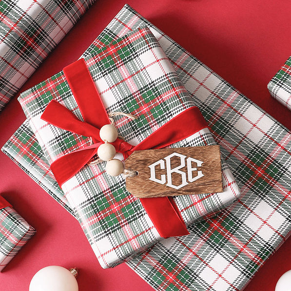 monogrammed wooden tag on christmas present