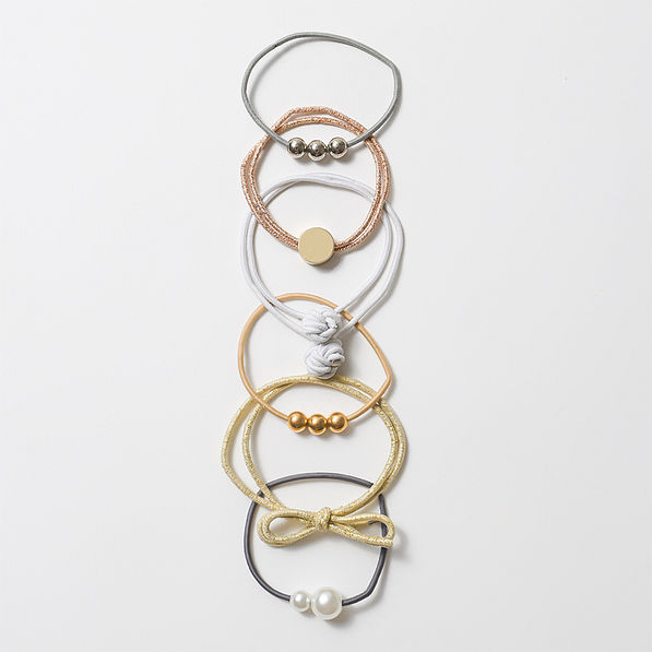 cute hair ties on vintage wood