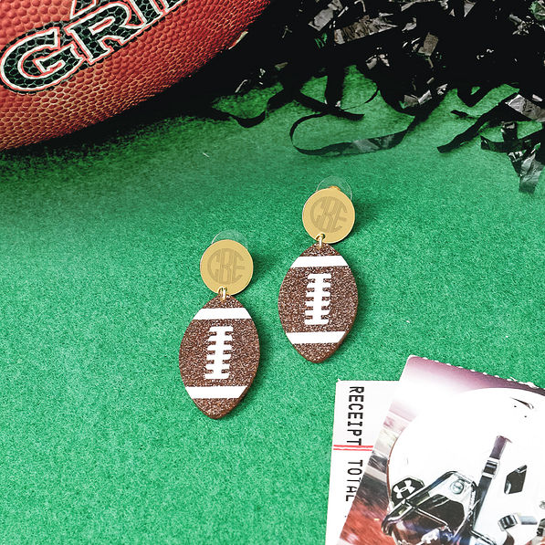personalized football earrings on turf with pom pom