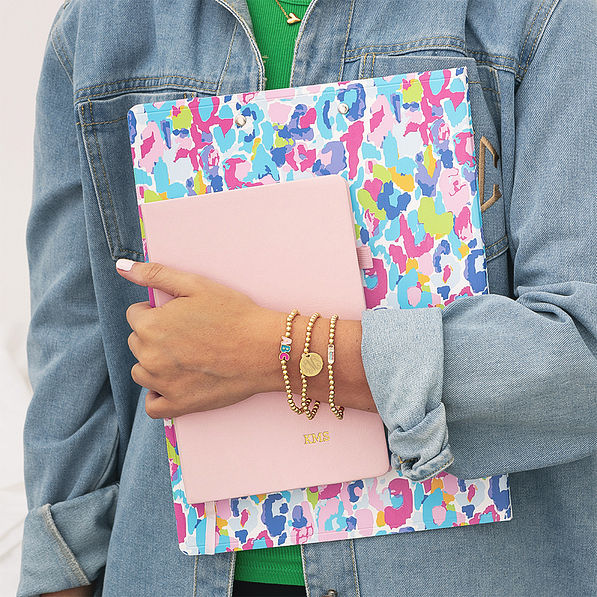 girl holding clipboard gold monogrammed teacher bracelet stack