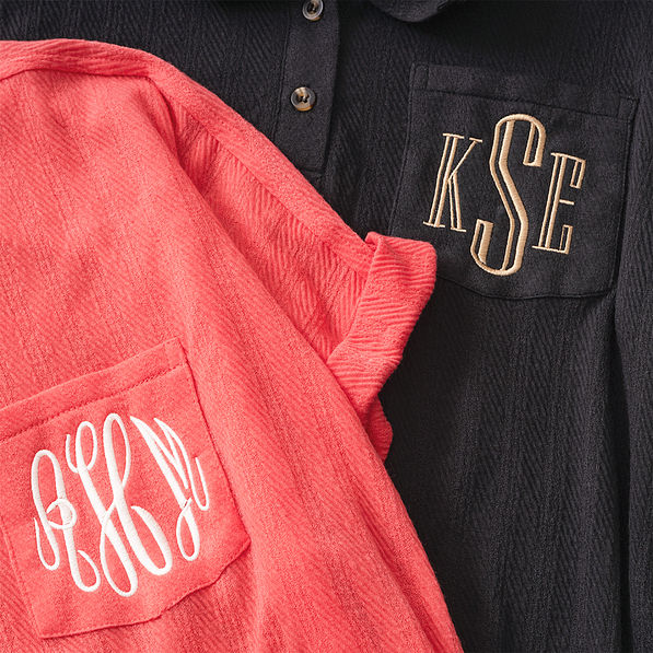coral and black monogrammed tops up close