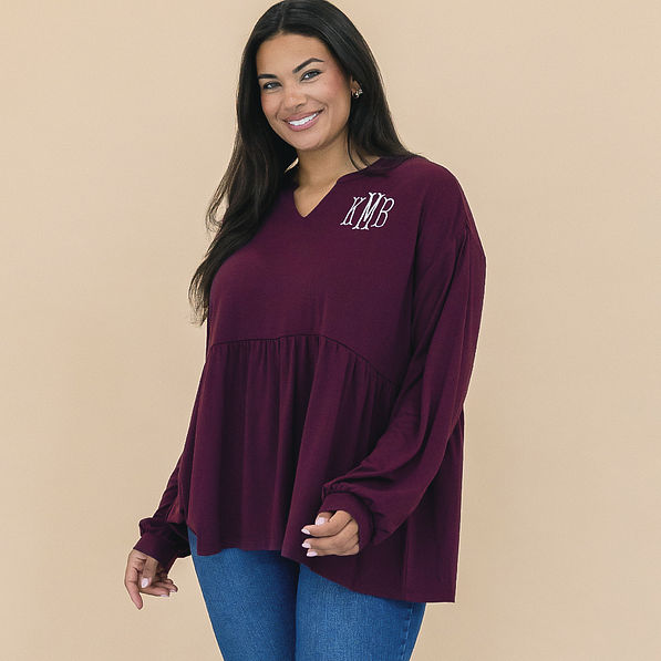 girl wearing personalized plum peplum top close up