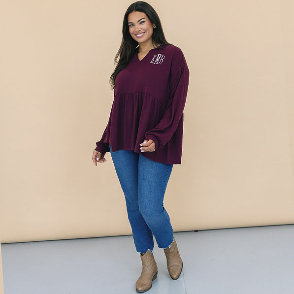 girl wearing personalized plum peplum top
