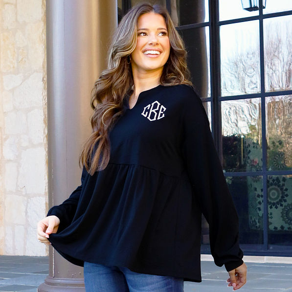 peplum top in front of house