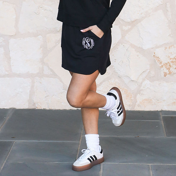 black athleisure skirt with socks and sneakers