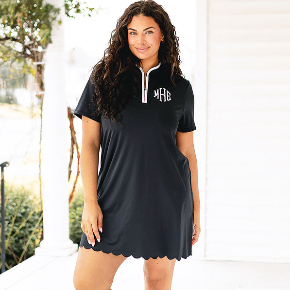 girl wearing quarter zip monogrammed dress in black